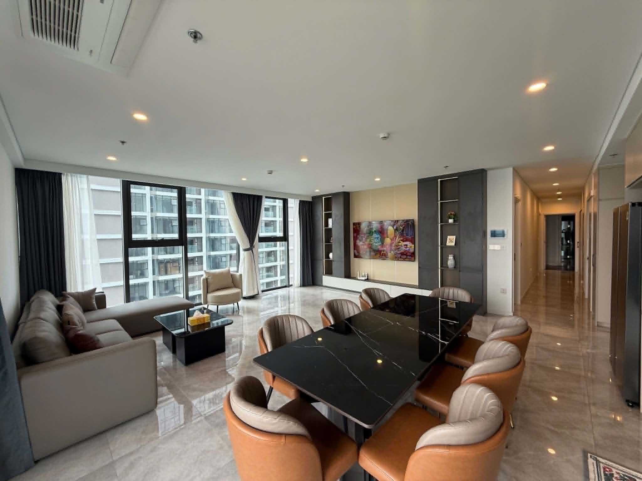Living room with a large window and grey sofa